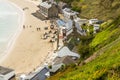 Editorial, People during Covid-19 pandemic outside the Ty Coch Inn at Porthdinllaen, Gwynedd, Wales, from above, wide angle,